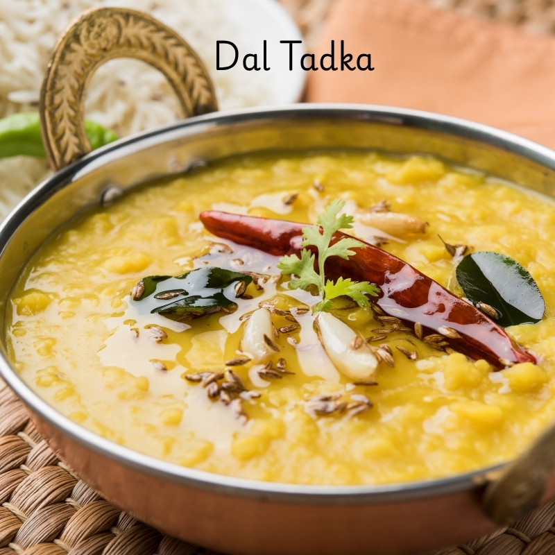 Dal tadka in a bowl with ghee and spices
